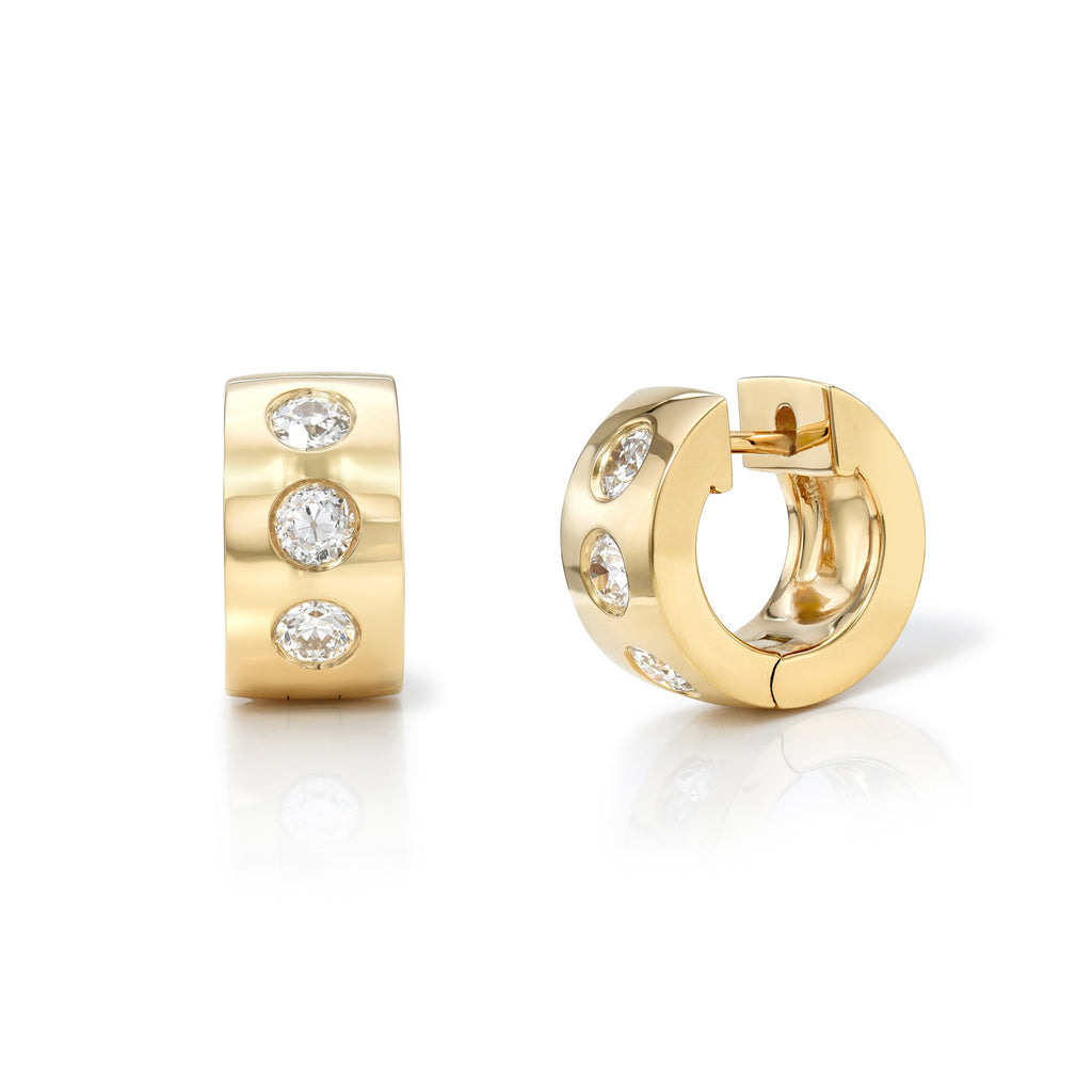 
Single Stone's Jenni huggies with diamonds earrings  featuring Approximately 0.70ctw G-H/VS old European cut diamonds set in handcrafted 18K yellow gold huggie earrings.
