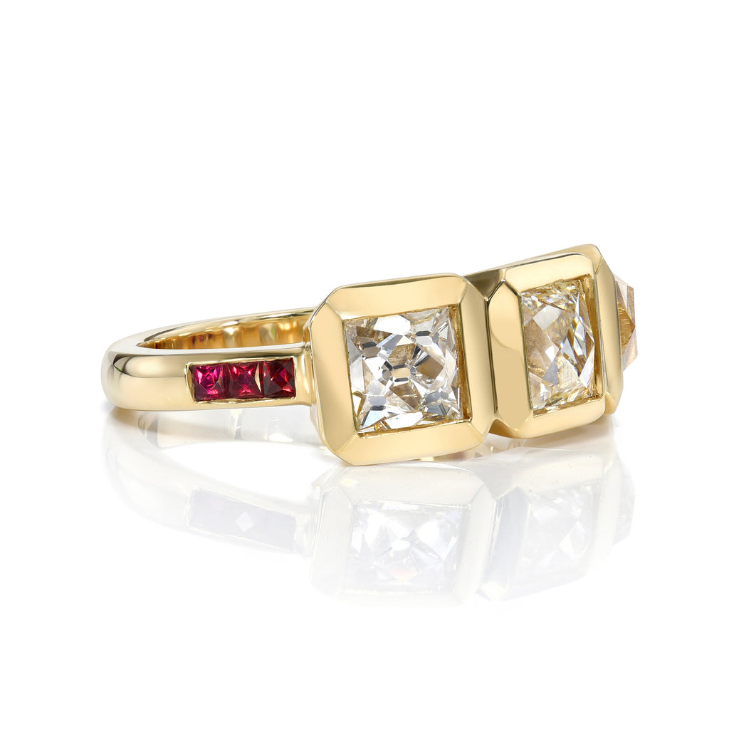Single Stone's THREE STONE KARINA ring  featuring 2.93ctw F-H/VS1-VS2-I1 GIA certified French cut diamonds with 0.24ctw square French cut rubies bezel set in a handcrafted 18K yellow gold mounting.
