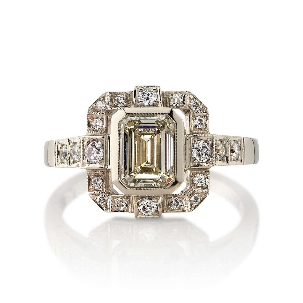 Single Stone's KATIE ring  featuring 1.01ct N/VS2 GIA certified emerald cut diamond with 0.34ctw old European cut accent diamonds set in a handcrafted 18K champagne white gold mounting.
