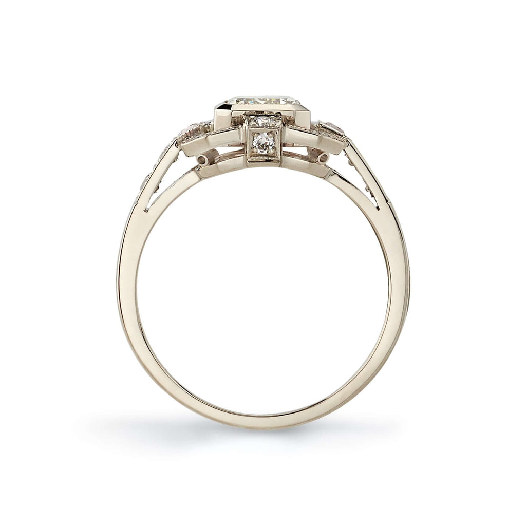 Single Stone's KATIE ring  featuring 1.01ct N/VS2 GIA certified emerald cut diamond with 0.34ctw old European cut accent diamonds set in a handcrafted 18K champagne white gold mounting.
