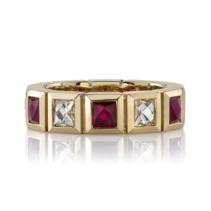 SINGLE STONE LARGE KARINA WITH DIAMONDS AND GEMSTONES BAND | Approximately 1.30ctw H-I/VS French cut diamonds alongside 1.10ctw alternating French cut gemstones bezel set in a handcrafted 18K yellow gold eternity band. Approximate band width 5.5mm. *Stone