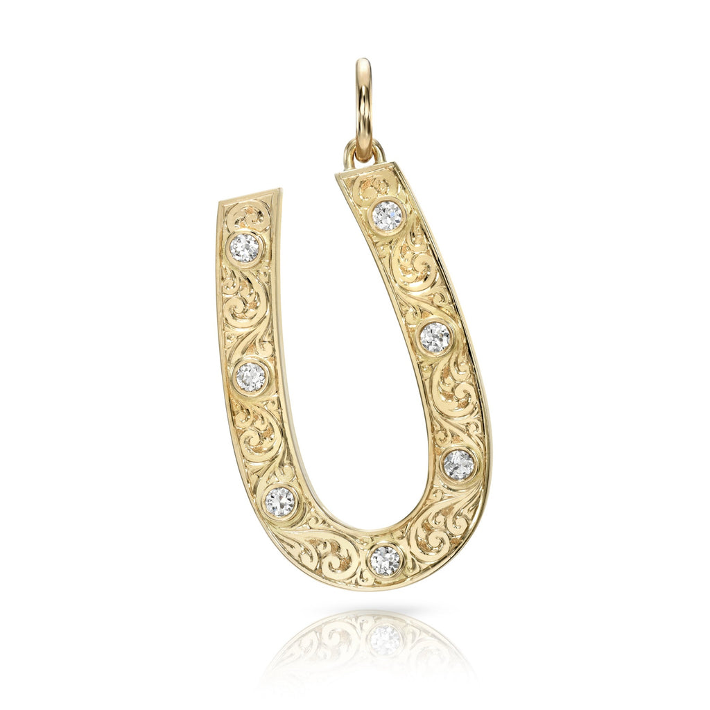 
Single Stone's Large marilyn pendant  featuring Approximately 0.70ctw G-H/VS old European cut diamonds bezel set in a handcrafted, hand engraved 18K yellow gold horseshoe pendant.
