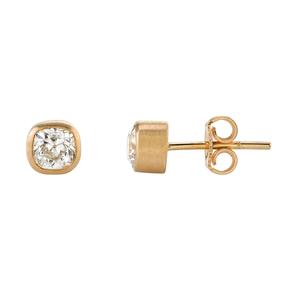 Single Stone's LAURA STUDS earrings  featuring 1.18ctw H/SI2 antique cushion cut diamonds bezel set in 18K rose gold stud earrings.
