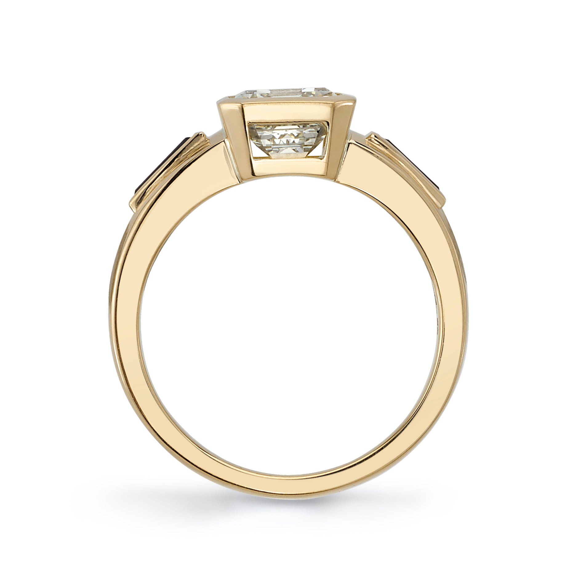 SINGLE STONE LAURIE RING featuring 2.09ct U-V/VS1 GIA certified emerald cut diamond with 0.73ctw baguette cut blue sapphire accents bezel set in a handcrafted 18K yellow gold mounting.
