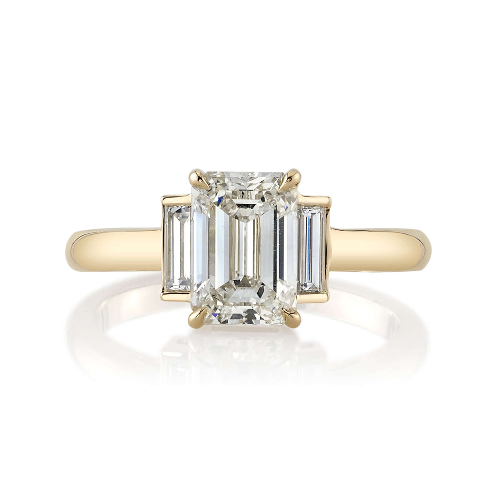 SINGLE STONE LONDON RING featuring 1.72ct M/VVS1 GIA certified emerald cut diamond with 0.25ctw baguette cut accent diamonds set in a handcrafted 18K yellow gold mounting.