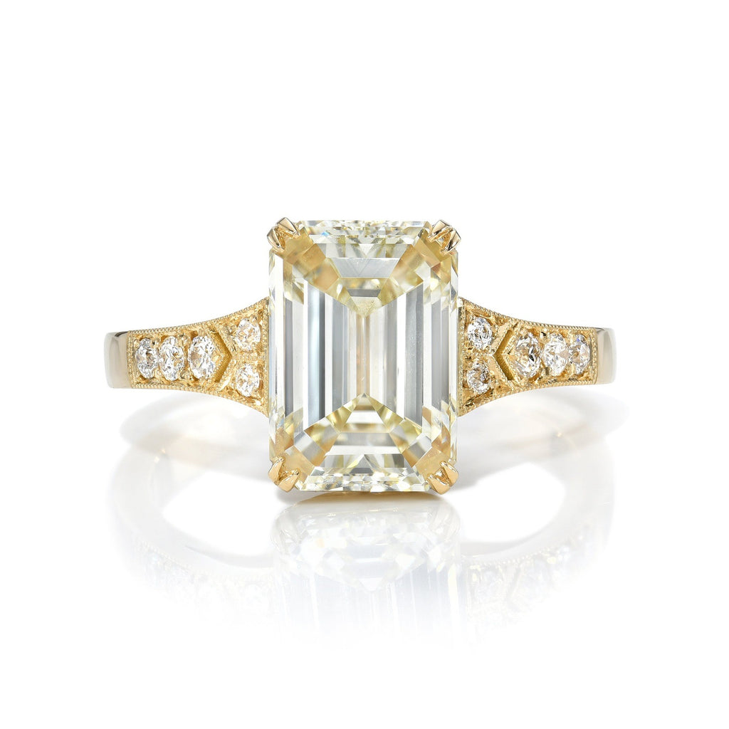 
Single Stone's Lorraine ring  featuring 3.01ct O-P/VS2 GIA certified emerald cut diamond with 0.07ctw old European cut accent diamonds set in a handcrafted 18K yellow gold mounting.


