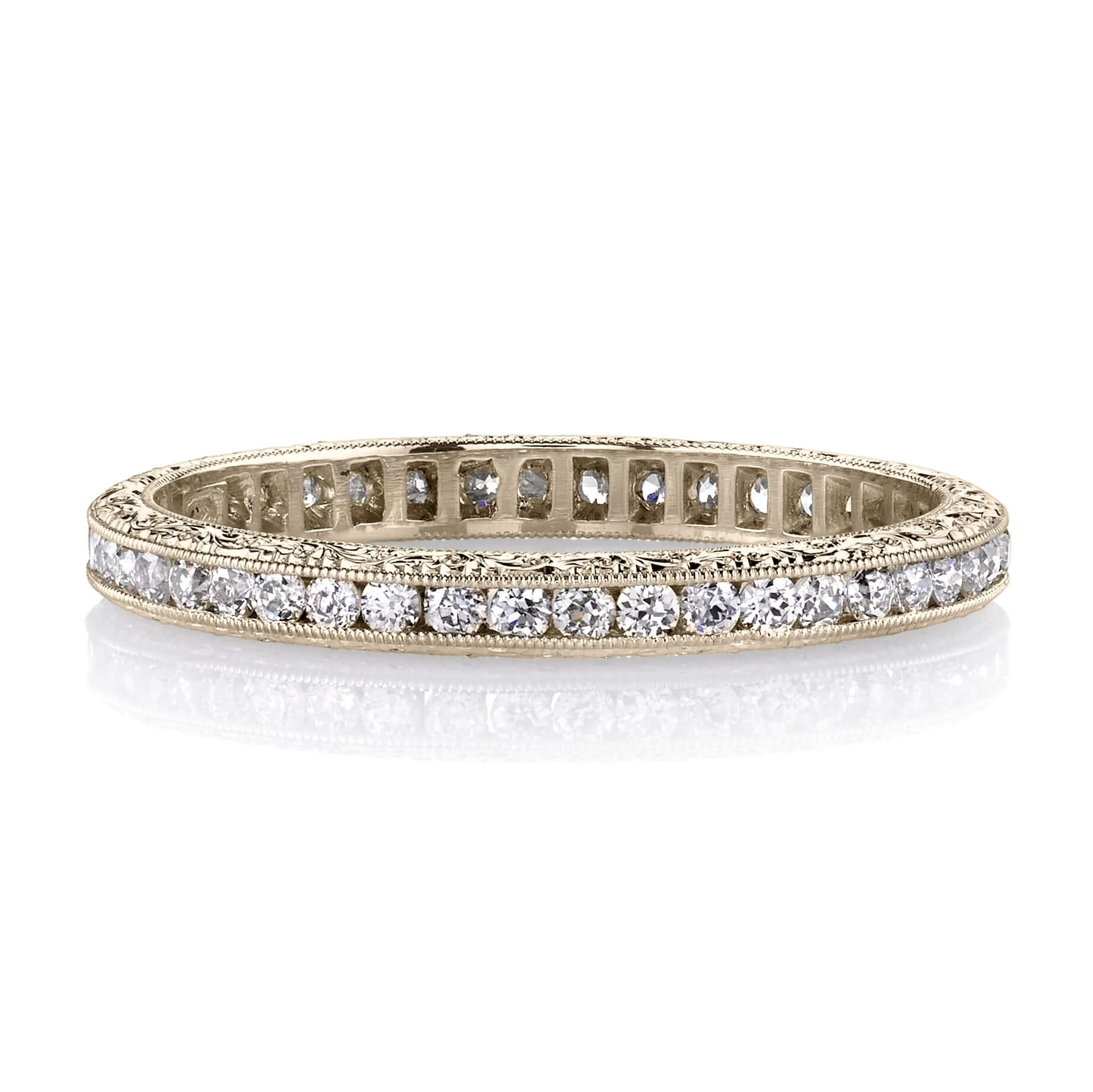 SINGLE STONE MADISON BAND | Approximately 0.40ctw old European cut diamonds channel set in a handcrafted eternity band. Available with polished or engraved sidewalls. Approximate band width 2.1mm.