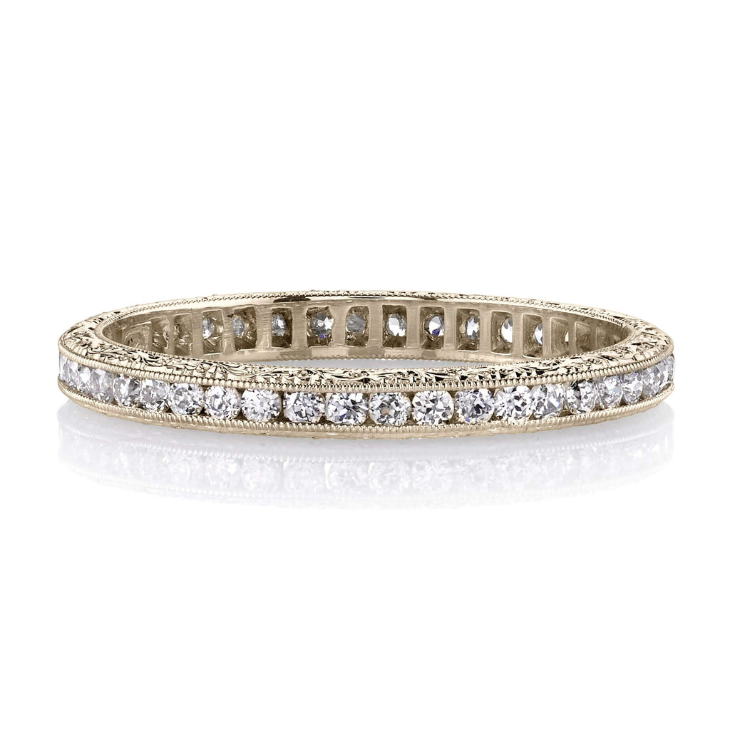 Single Stone's MADISON band  featuring Approximately 0.40ctw old European cut diamonds channel set in a handcrafted eternity band. Available with polished or engraved sidewalls.  Approximate band width 2.1mm.
