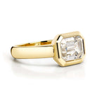 SINGLE STONE MARNI RING featuring 2.14ct L/VS1 GIA certified Emerald cut diamond bezel set in a handcrafted 18K yellow gold mounting.