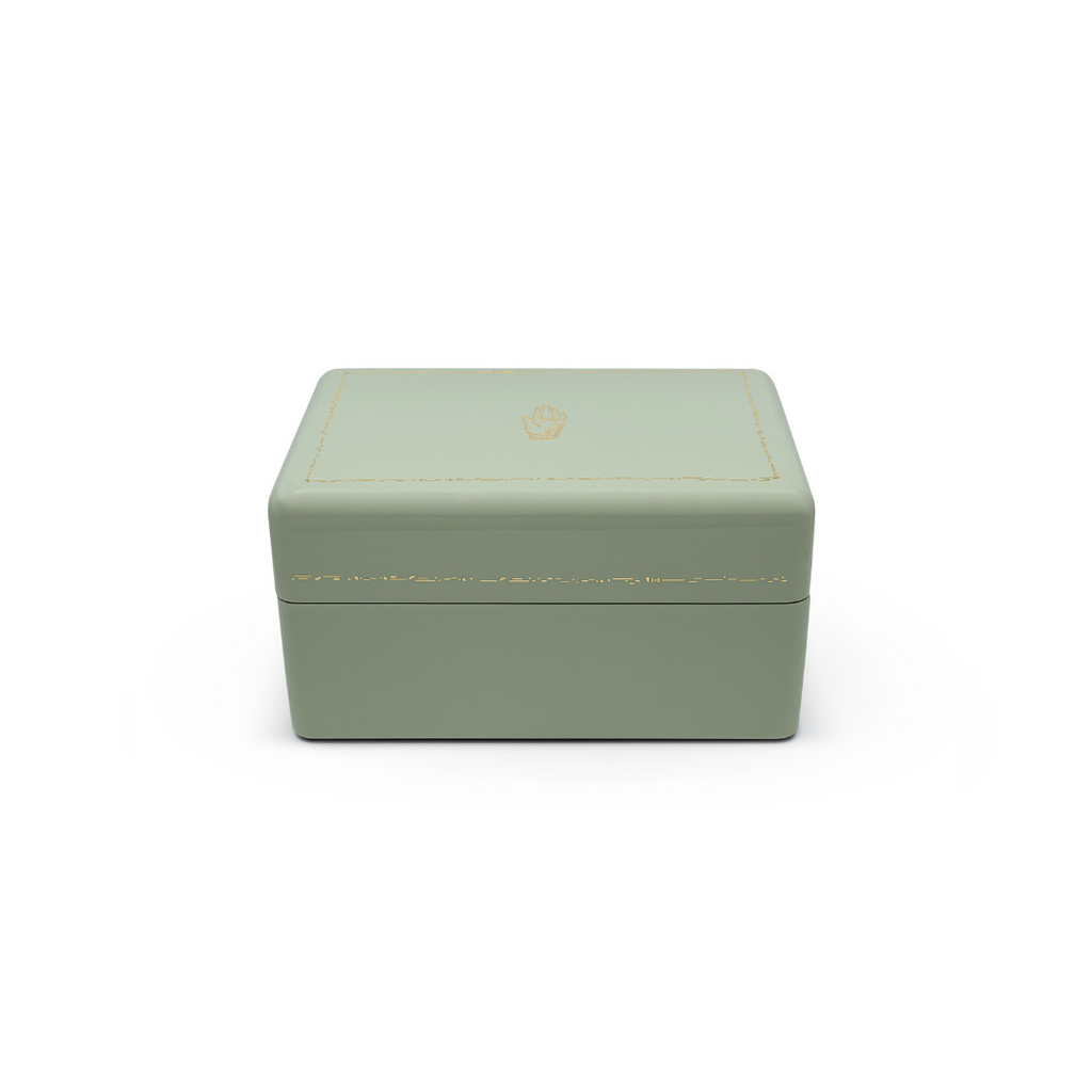 
Single Stone's Mint mini trunk  featuring 
Color: Mint with warm grey and green interior
Wood with high lacquer finish
3 levels of storage
Features delicate gold effect inlay
Brass plated hardware 
Faux suede interior
10" x 6.9" x 5.1"

