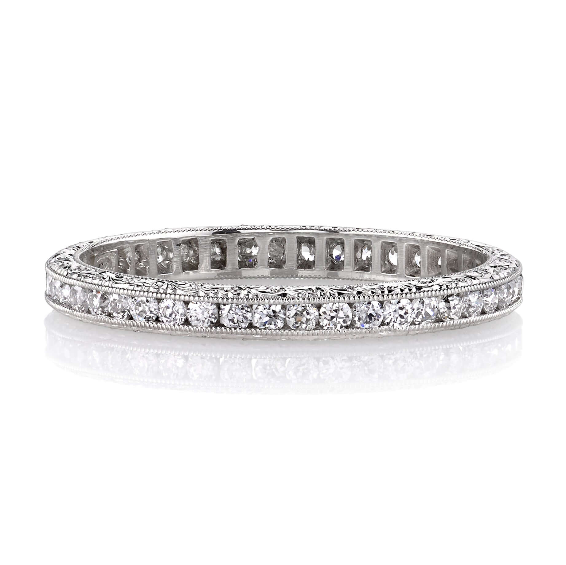 SINGLE STONE MADISON BAND | Approximately 0.40ctw old European cut diamonds channel set in a handcrafted eternity band. Available with polished or engraved sidewalls. Approximate band width 2.1mm.