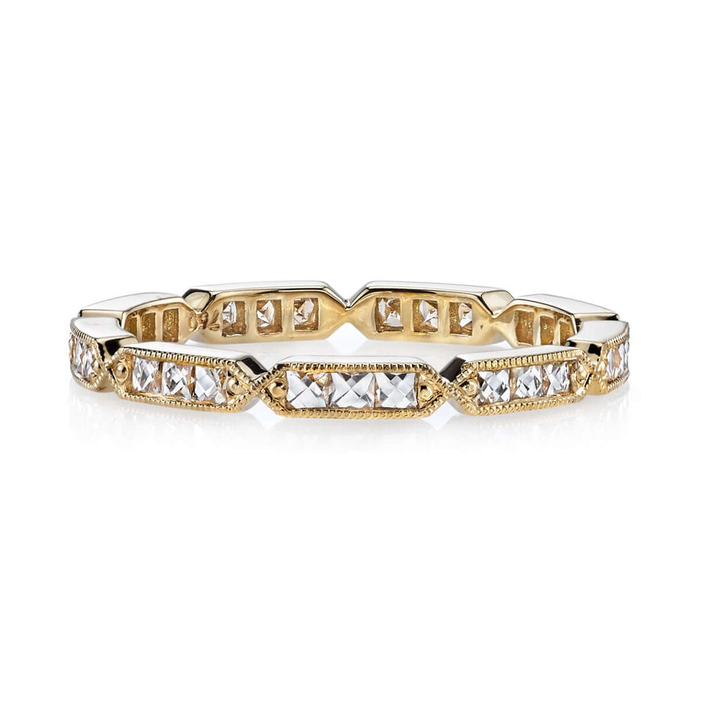 
Single Stone's Olivia band  featuring Approximately 0.50ctw G-H/VS French cut diamonds channel set in a handcrafted sectional eternity band. 
Approximate band with 2.1mm. 
Please inquire for additional customization. 
