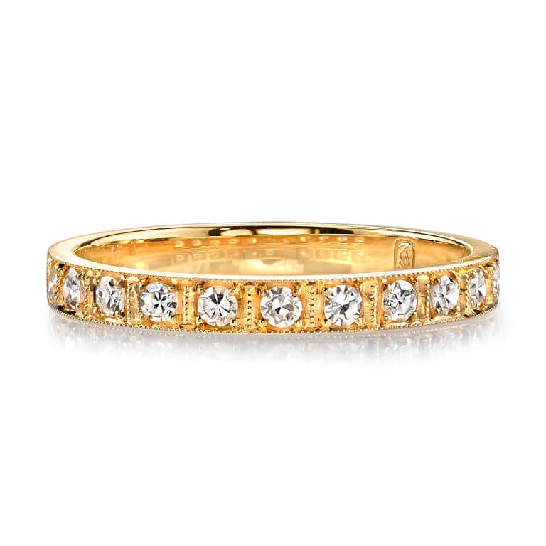 
Single Stone's Hadley band  featuring Approximately 0.20ctw G-H/VS old European cut diamonds prong set in a handcrafted half eternity band. 
Approximate band width 2.3mm.
Please inquire for additional customization.
