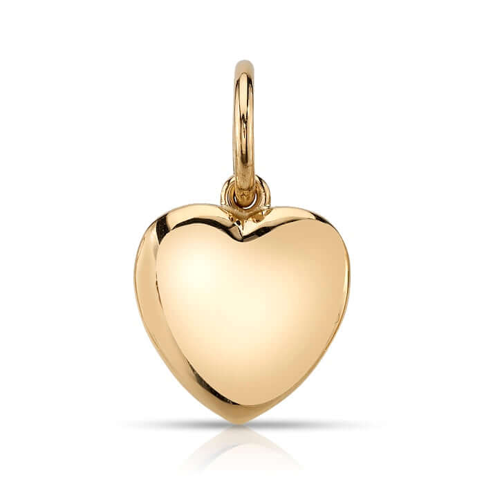 Single Stone's VIOLA pendant  featuring Handcrafted 18K yellow gold heart-shaped charm. -Every year, 12 million girls are married before the age of 18...that’s one girl every three seconds. We designed this beautiful heart charm with Vow for Girls. For every heart purchased, 15% of the proceeds will support VOW because we believe that every girl should have 
