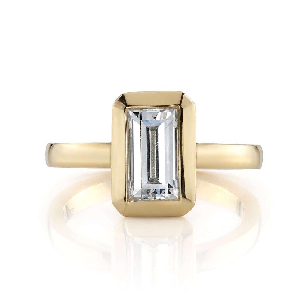 Single Stone's BEA ring  featuring 1.27ct I/VS2 GIA certified rectangular step cut diamond bezel set in a handcrafted 18K yellow gold mounting.
