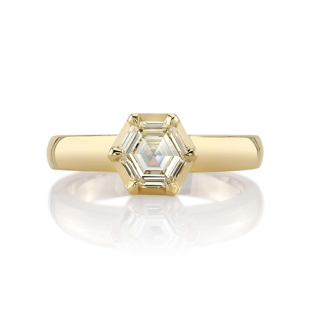 
Single Stone's Odette ring  featuring 1.01ct K/VS1 GIA certified hexagonal step cut diamond prong set in a handcrafted 18K yellow gold mounting.

