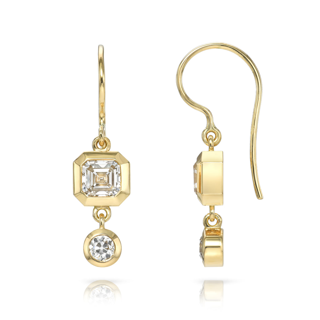 
Single Stone's Paloma double drops earrings  featuring 2.06ctw K/VS2 GIA certified emerald cut diamonds with 0.43ctw G-H/VS old European cut accent diamonds bezel set in handcrafted 18K yellow gold double drop earrings.
