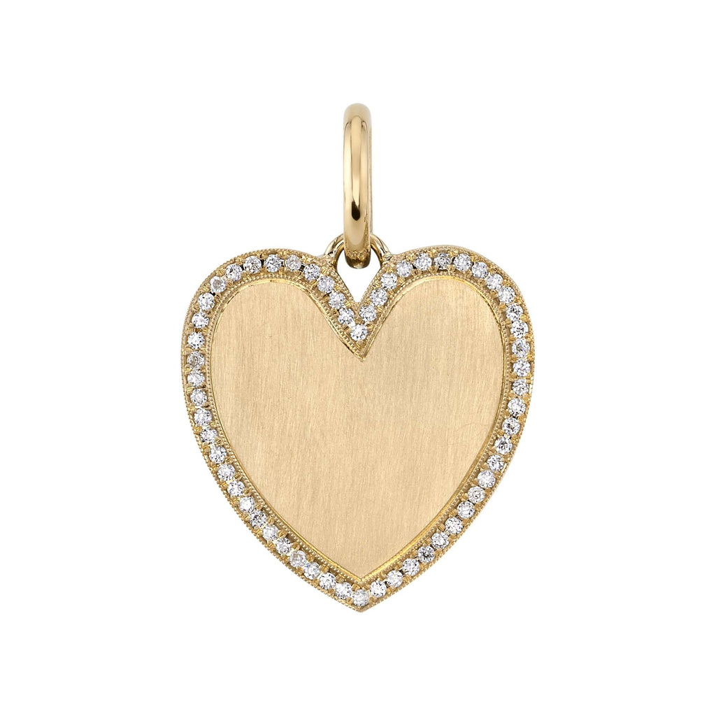 
Single Stone's Minnie with pavé pendant  featuring Approximately 0.25ctw old European cut diamonds pavé a handcrafted 18K yellow gold heart shaped charm. Price does not include chain. 
Charm measures 21mm x 24mm.

