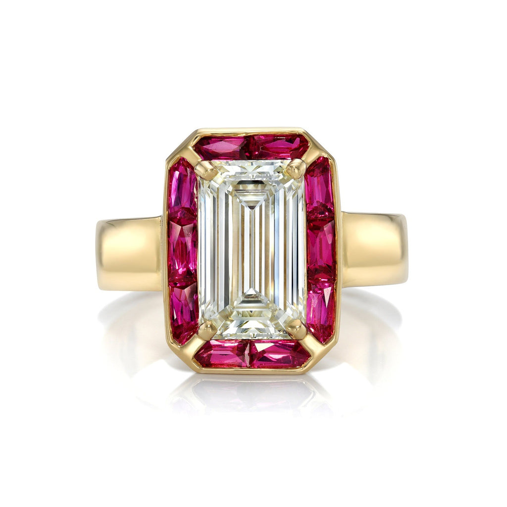
Single Stone's Pippa ring  featuring 2.52ct M/VS2 GIA certified emerald cut diamond with 1.09ctw French cut rubies set in a handcrafted 18K yellow gold mounting.
