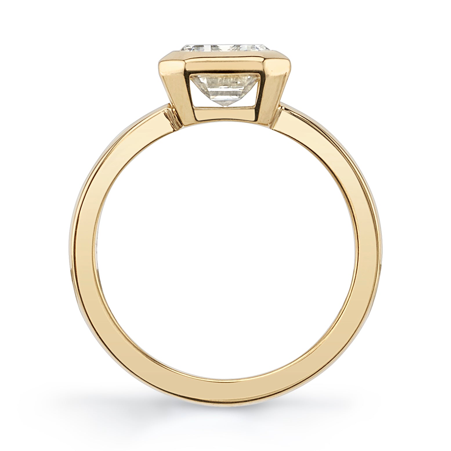 SINGLE STONE RAE RING featuring 2.03ct N/VS1 GIA certified emerald cut diamond bezel set in a handcrafted 18K yellow gold mounting.