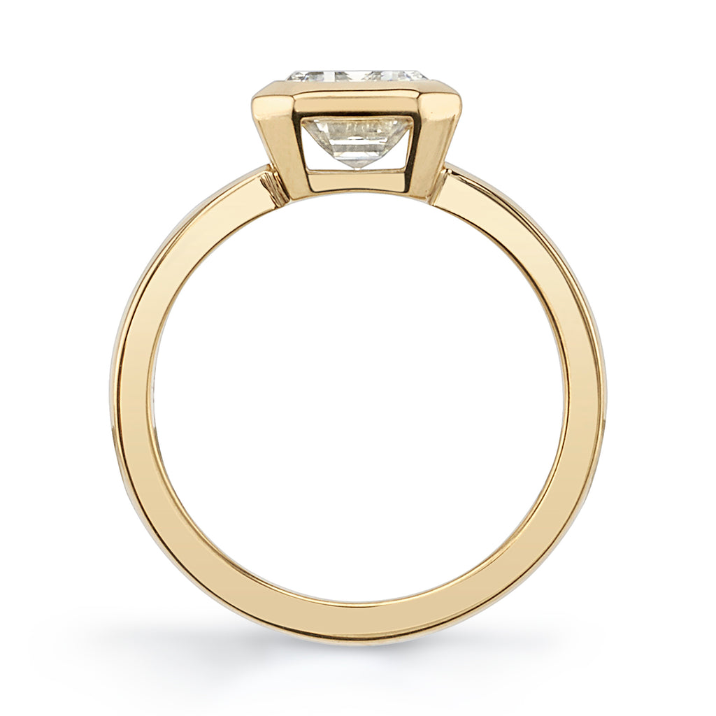 Single Stone's RAE ring  featuring 2.03ct N/VS1 GIA certified emerald cut diamond bezel set in a handcrafted 18K yellow gold mounting.
