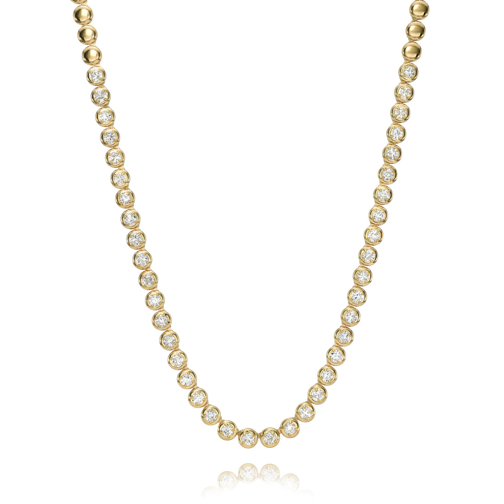 
Single Stone's Randi riviera necklace earrings  featuring 8.60ctw G-H/VS-SI Old European cut diamonds prong set in a handcrafted 18K yellow gold necklace. 
Necklace measures 17".
