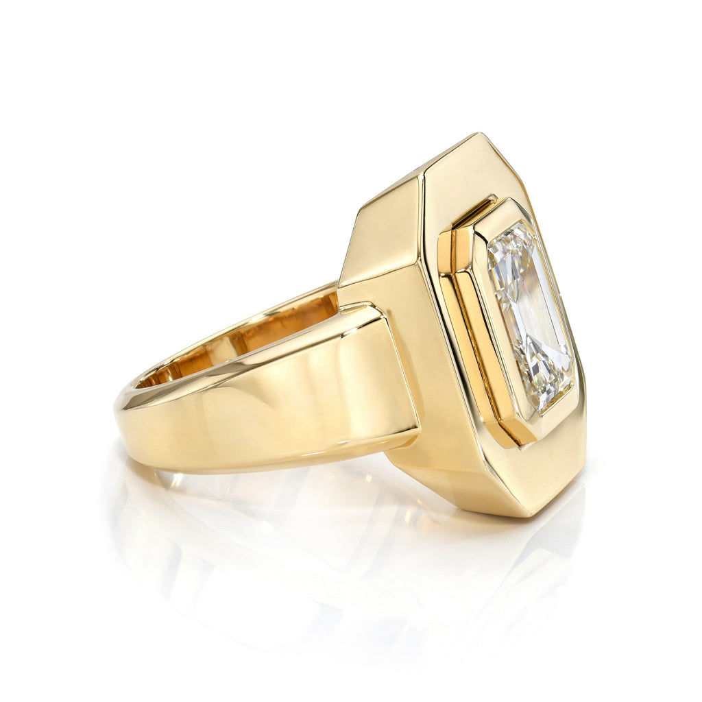 Single Stone's RENA ring  featuring 2.65ct M/VVS2 GIA certified antique emerald cut diamond bezel set in a handcrafted 18K yellow gold mounting.
