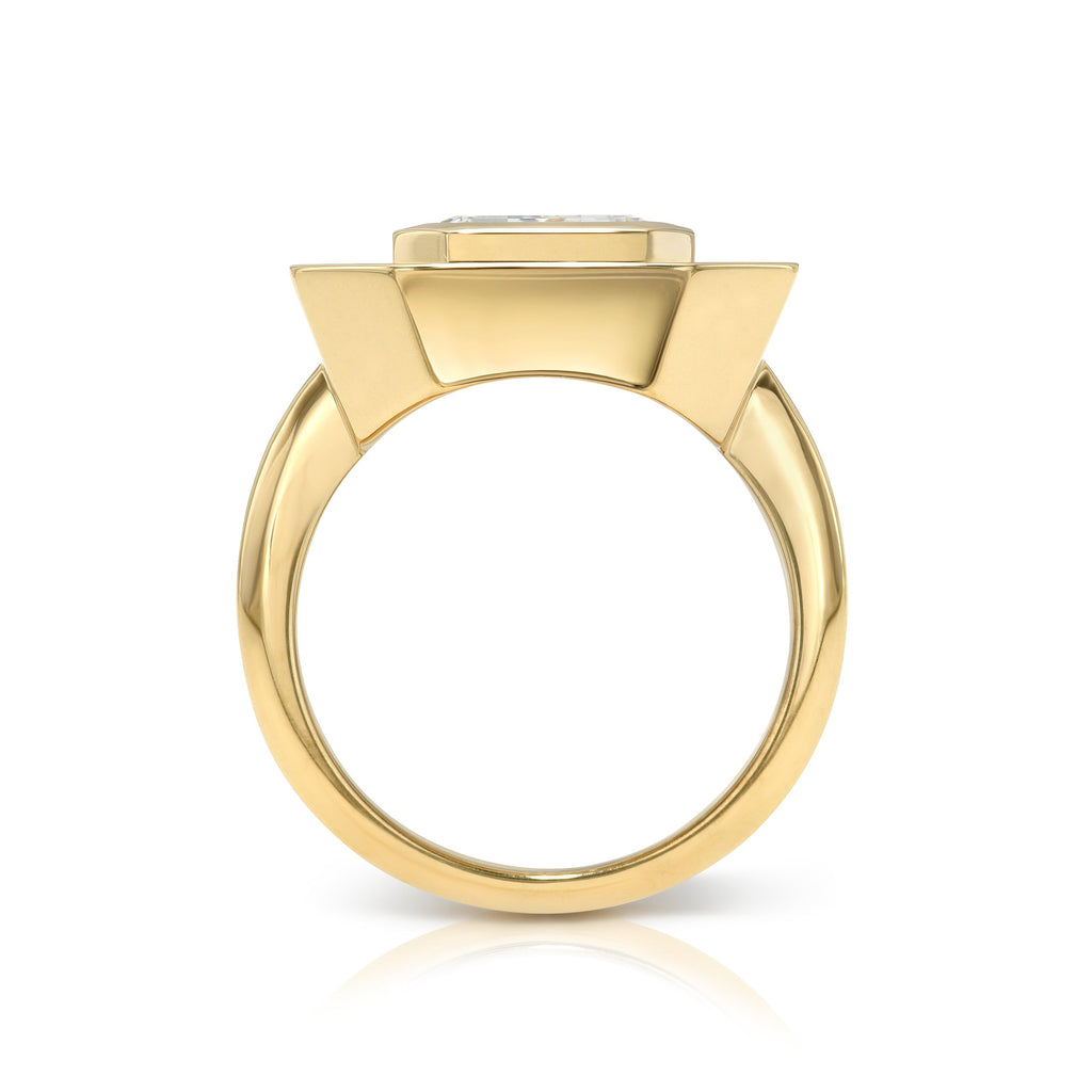 Single Stone's RENA ring  featuring 2.65ct M/VVS2 GIA certified antique emerald cut diamond bezel set in a handcrafted 18K yellow gold mounting.  
