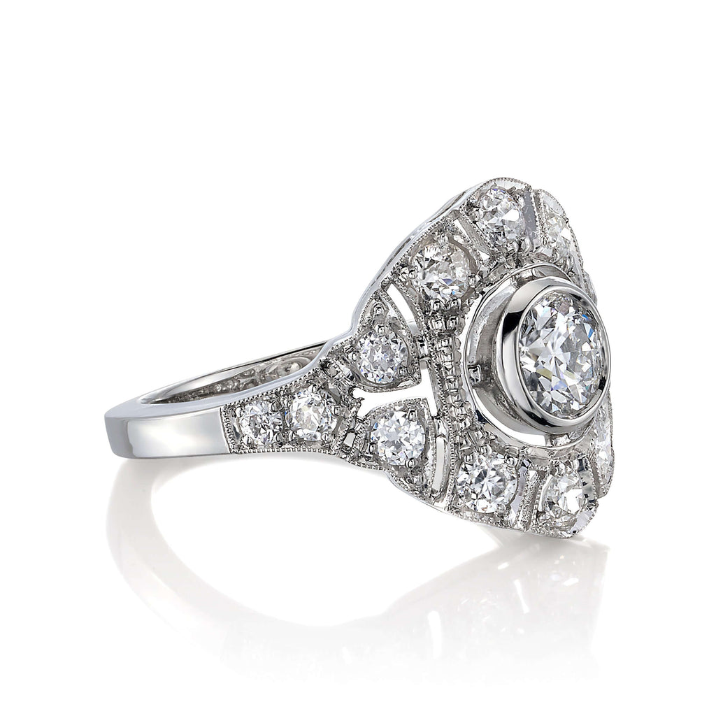 Single Stone's RENEE  featuring 0.48ctw G/VS2 GIA certified old European cut diamond with 0.65ctw old European cut accent diamonds bezel set in a handcrafted platinum mounting.
