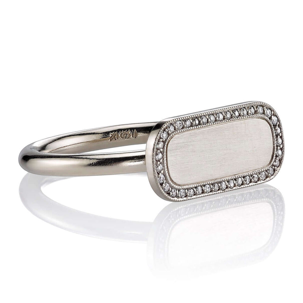Single Stone's MILO ring  featuring Vintage inspired 18K gold bar ring. A modern take on the classic signet ring. Make it personal! Price includes monogrammed engraving of up to three letters in any of the styles shown above - please be sure to specify before placing your order. Please contact us to inquire about additional customization.
