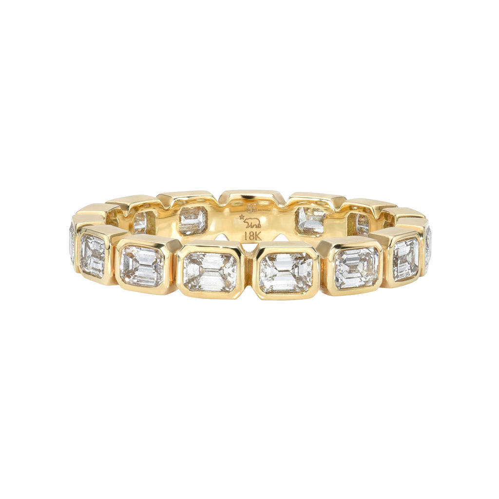 
Single Stone's Sierra band  featuring Approximately 1.40ctw H-I/VS emerald cut diamonds bezel set in a handcrafted eternity band. 
Approximate band with 2.5mm. 
Please inquire for additional customization. 
