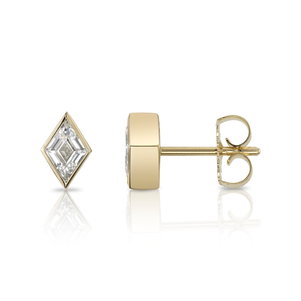 
Single Stone's Sloane studs earrings  featuring 0.63ctw F/VS lozenge cut diamonds bezel set in handcrafted 18K yellow gold stud earrings.
