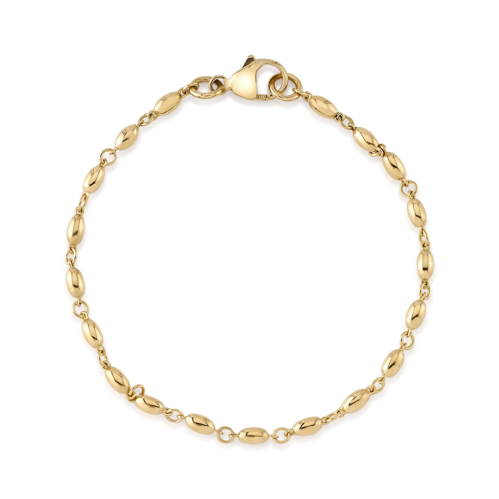 
Single Stone's Small dorothy bracelet  featuring Handcrafted 18K yellow gold long bead bracelet.
Bracelet measures 7.5".

