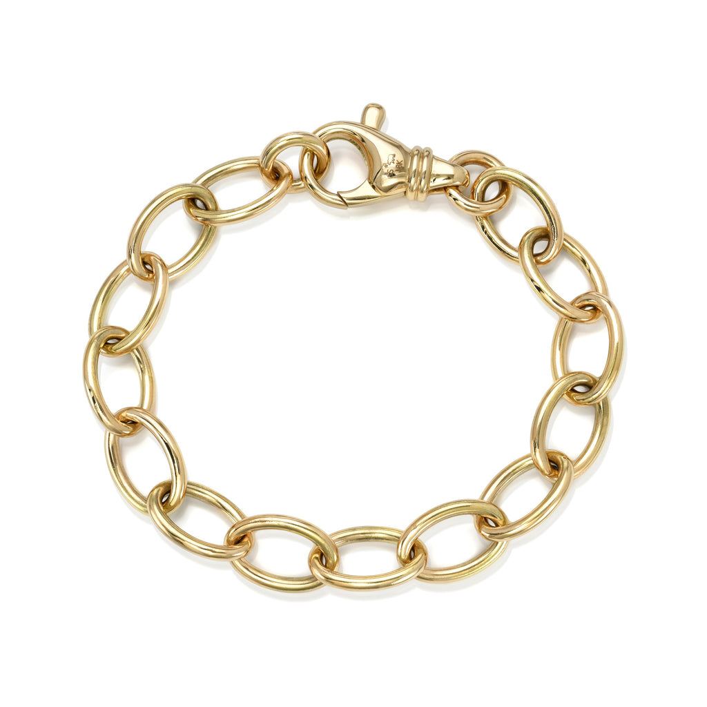 
Single Stone's Sport luxe bracelet  featuring Handcrafted 18K yellow gold wide oval link bracelet. 
Bracelet measures 7.5".


