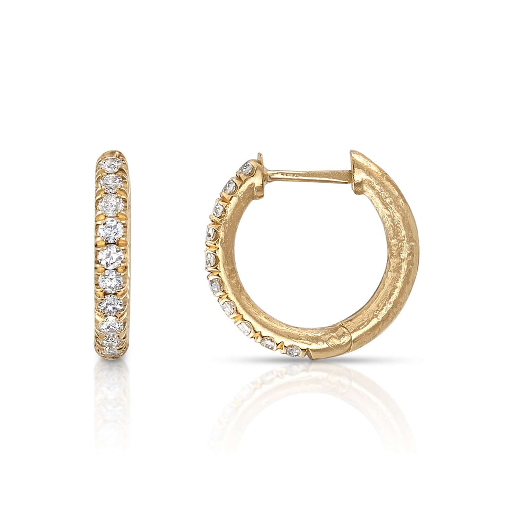
Single Stone's Stevie huggies earrings  featuring Approximately 0.20ctw G-H/VS old European cut diamonds set in handcrafted hammer finished 18K yellow gold huggie earrings.
 
