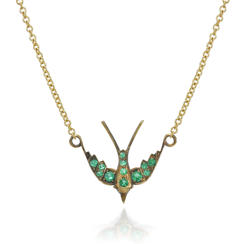 Single Stone's SMALL SWALLOW NECKLACE WITH GEMSTONES  featuring Approximately 0.35ctw round cut color gemstones set in a handcrafted 18K yellow gold swallow pendant necklace. Available in an oxidized or polished finish. Necklace measures 17&quot;.
