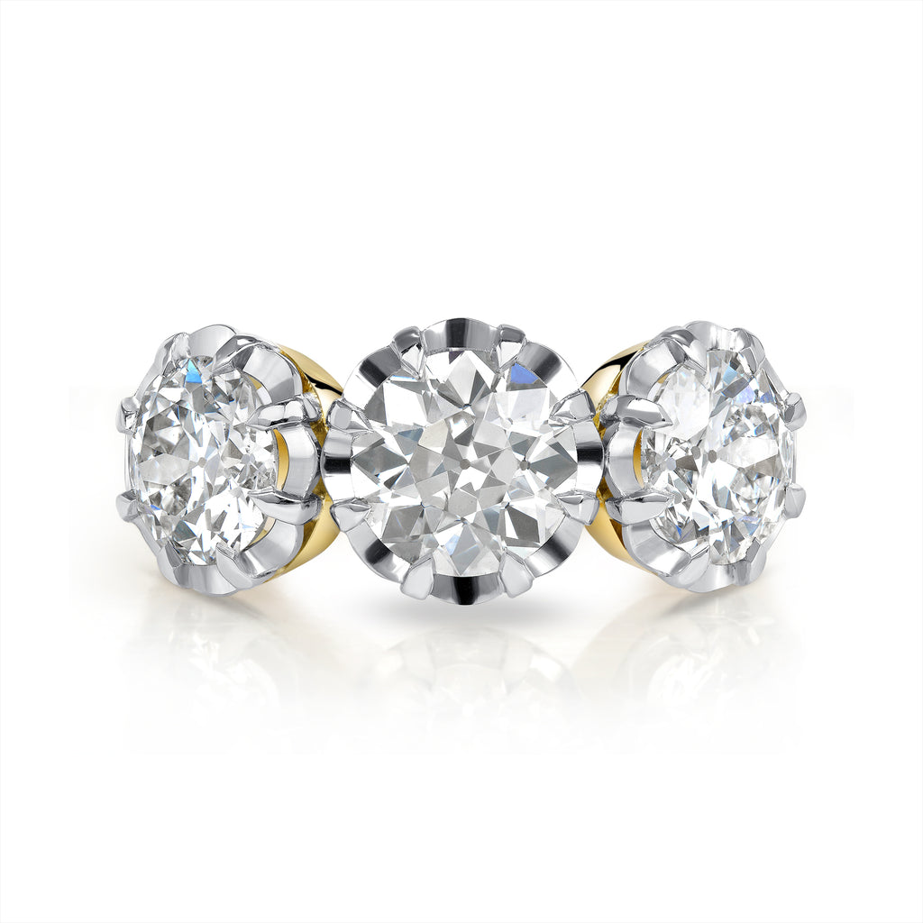Single Stone's THREE STONE JOLENE ring  featuring 1.34ct H/SI2 old European cut diamond with 2.05ctw old European cut accent diamonds prong set in a handcrafted 18K yellow gold and platinum mounting.
