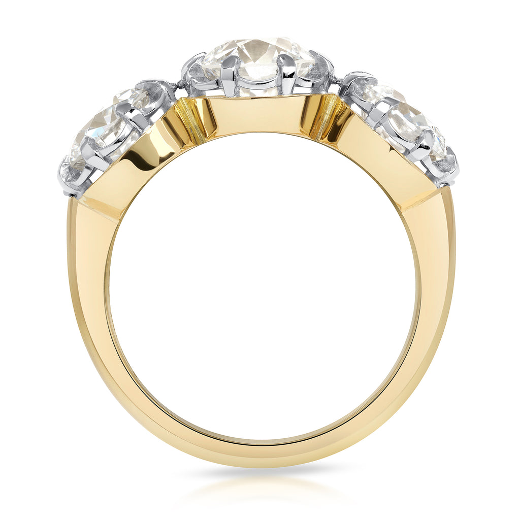 Single Stone's THREE STONE JOLENE ring  featuring 1.34ct H/SI2 old European cut diamond with 2.05ctw old European cut accent diamonds prong set in a handcrafted 18K yellow gold and platinum mounting.
