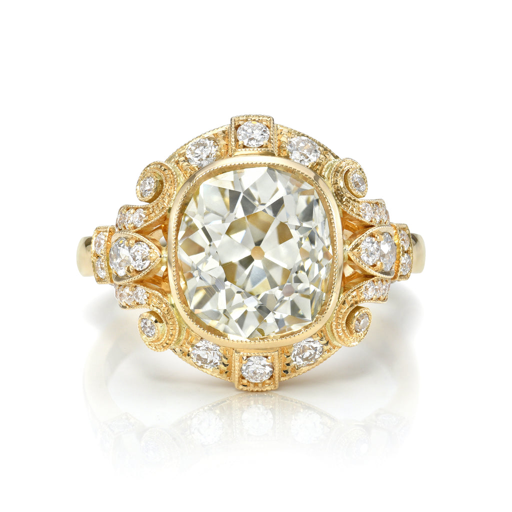 
Single Stone's Tiffany ring  featuring 3.36ct O-P/SI1 antique cushion cut diamond with 0.46ctw old European cut accent diamonds set in a handcrafted 18K yellow gold mounting.
