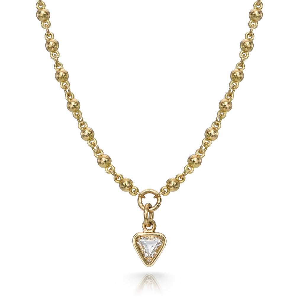 
Single Stone's Veda pendant  featuring 0.65ct G/I1 trillion cut diamond bezel set on a handcrafted 18K yellow gold pendant necklace.
Necklace measures 17".
