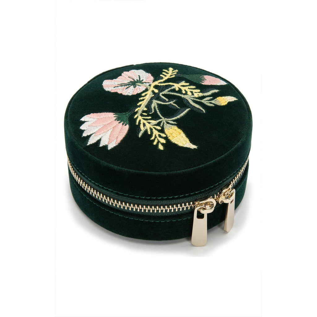 
Single Stone's Zoe round travel case  featuring 
Forest green velvet
Mirror, 7 ring rolls, 2 compartments and a zip pouch
LusterLoc™: Allows the fabric lining the inside of your jewelry cases to absorb the hostile gases known to cause tarnishing. Under typical storage conditions, it can prevent tarnishing for up to 35 years.

