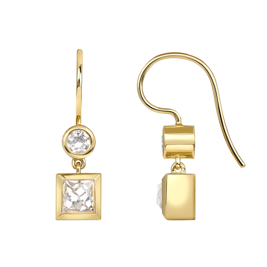 
Single Stone's Karina double drops earrings  featuring 1.82ctw H-I/VS2 GIA certified French cut diamonds with 0.38ctw old European cut accent diamonds bezel set in handcrafted 18K yellow gold double drop earrings. 

