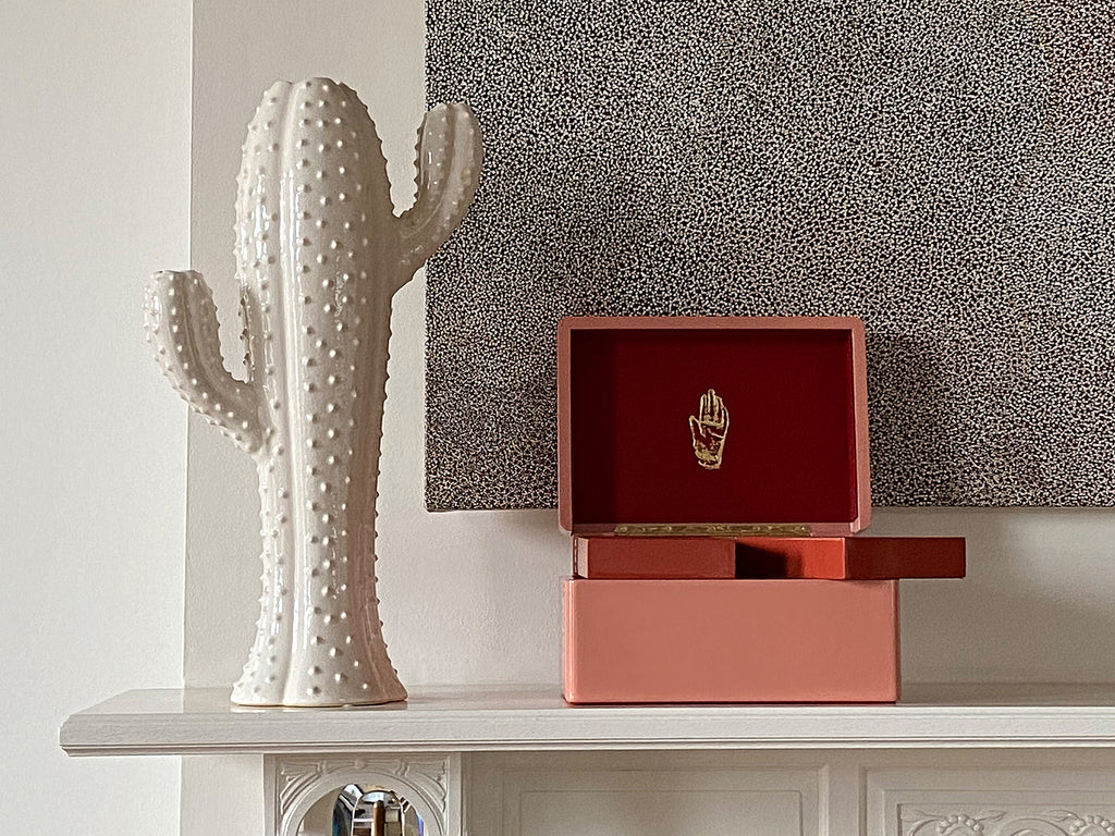 Single Stone's BLUSH TRUNK  featuring Color: Blush with burnt terracotta interior 3 levels of storage Wood with high lacquer finish Features delicate gold effect inlay Brass plated hardware Faux suede interior 11.8&quot; x 8.3&quot; x 6.3&quot;
