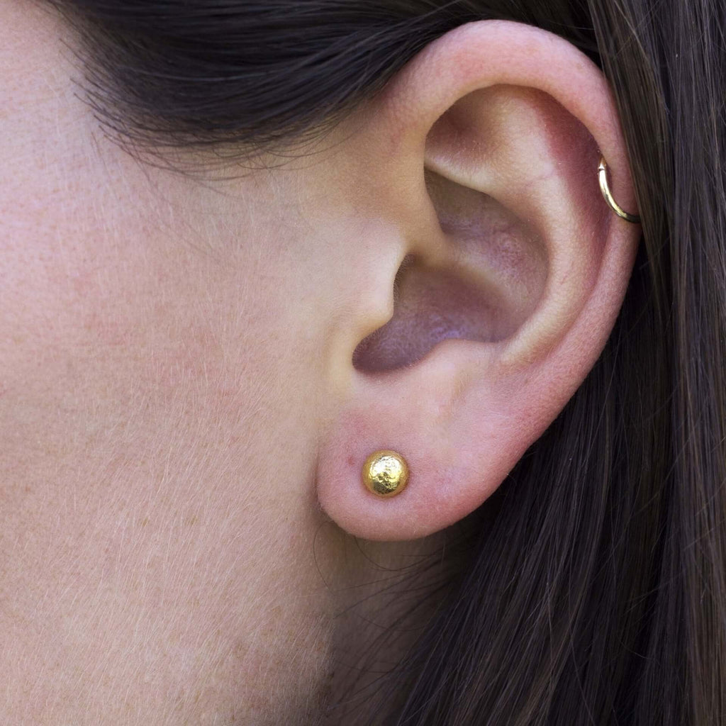 Single Stone's VERA STUDS earrings  featuring Handcrafted 22K yellow gold hammered stud earrings.
